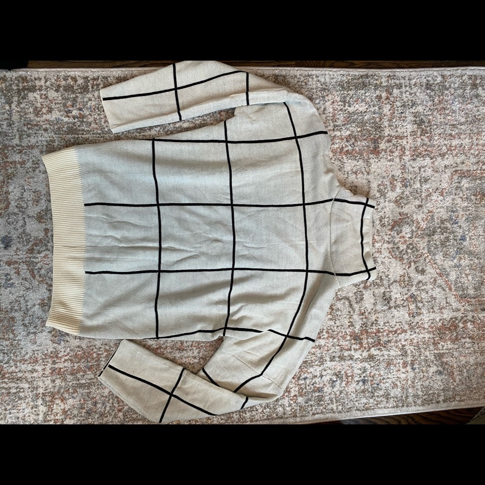 Black and white grid mock turtleneck sweater